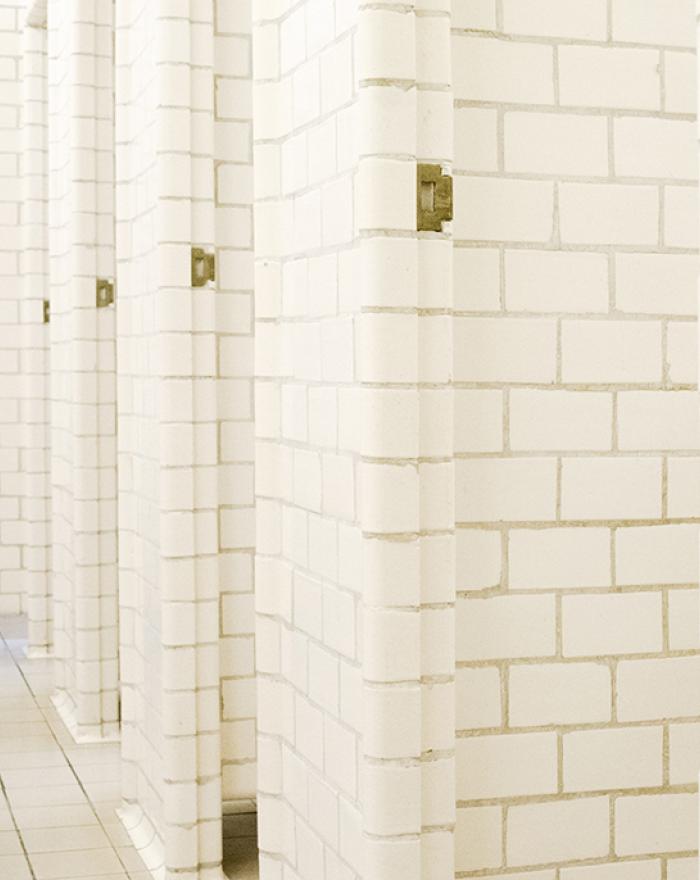 Original individual stalls in the men's changing room at Sundhöll Reykjavík Pool