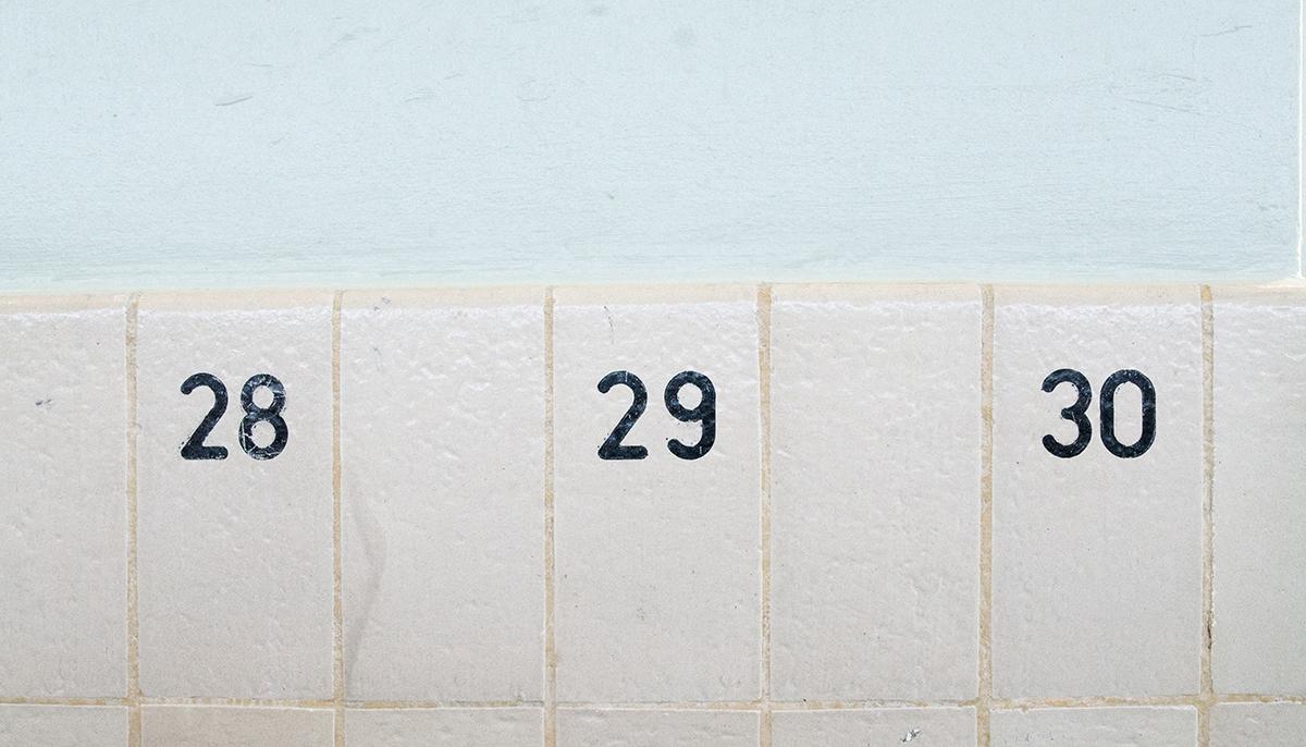 Numbered tiles in the original changing rooms at Sundhöll Reykjavík Pool