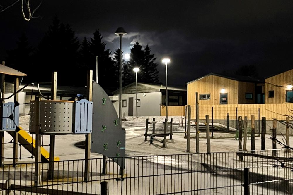 Kvistaborg Preschool at night in the moonlight, viewed from the preschool grounds