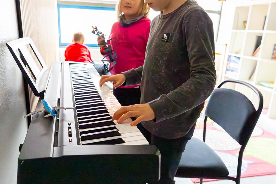Children playing piano.